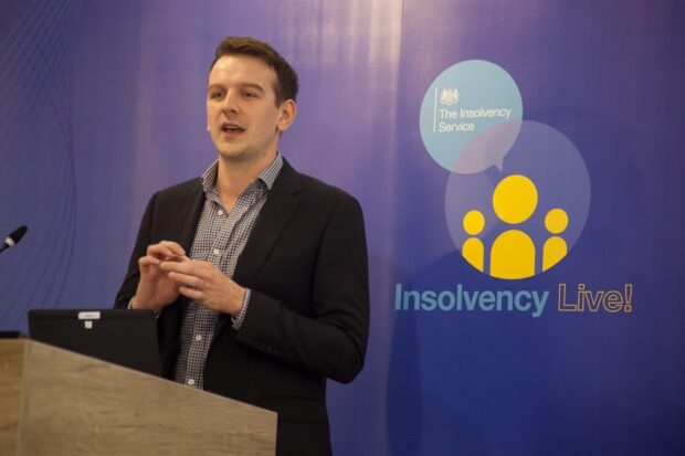 Daniel Kelly of the Money & Pensions Service speaking at a podium at the Insolvency Live! event