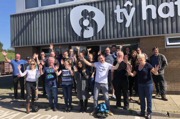 Staff from the Long Term Asset Distribution team in Cardiff pictured outside the offices of Tŷ Hafan