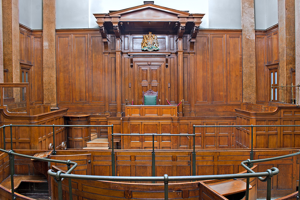 View of the inside of a wood-panelled court room