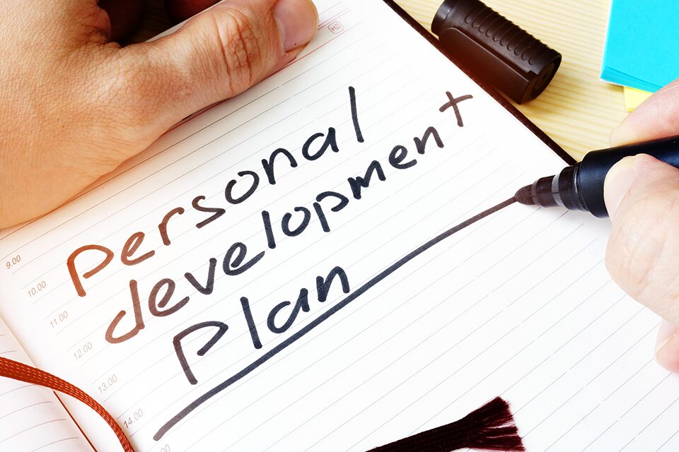 Graphic showing the words Personal development plan written in a diary